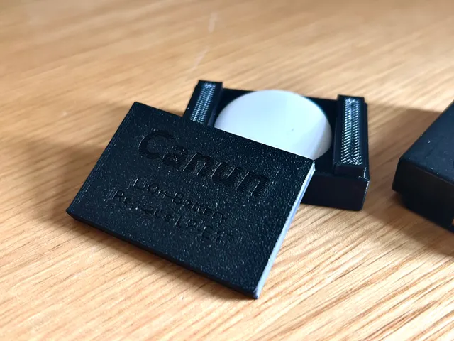 Canon LP-E17 dummy with Apple AirTag Integration