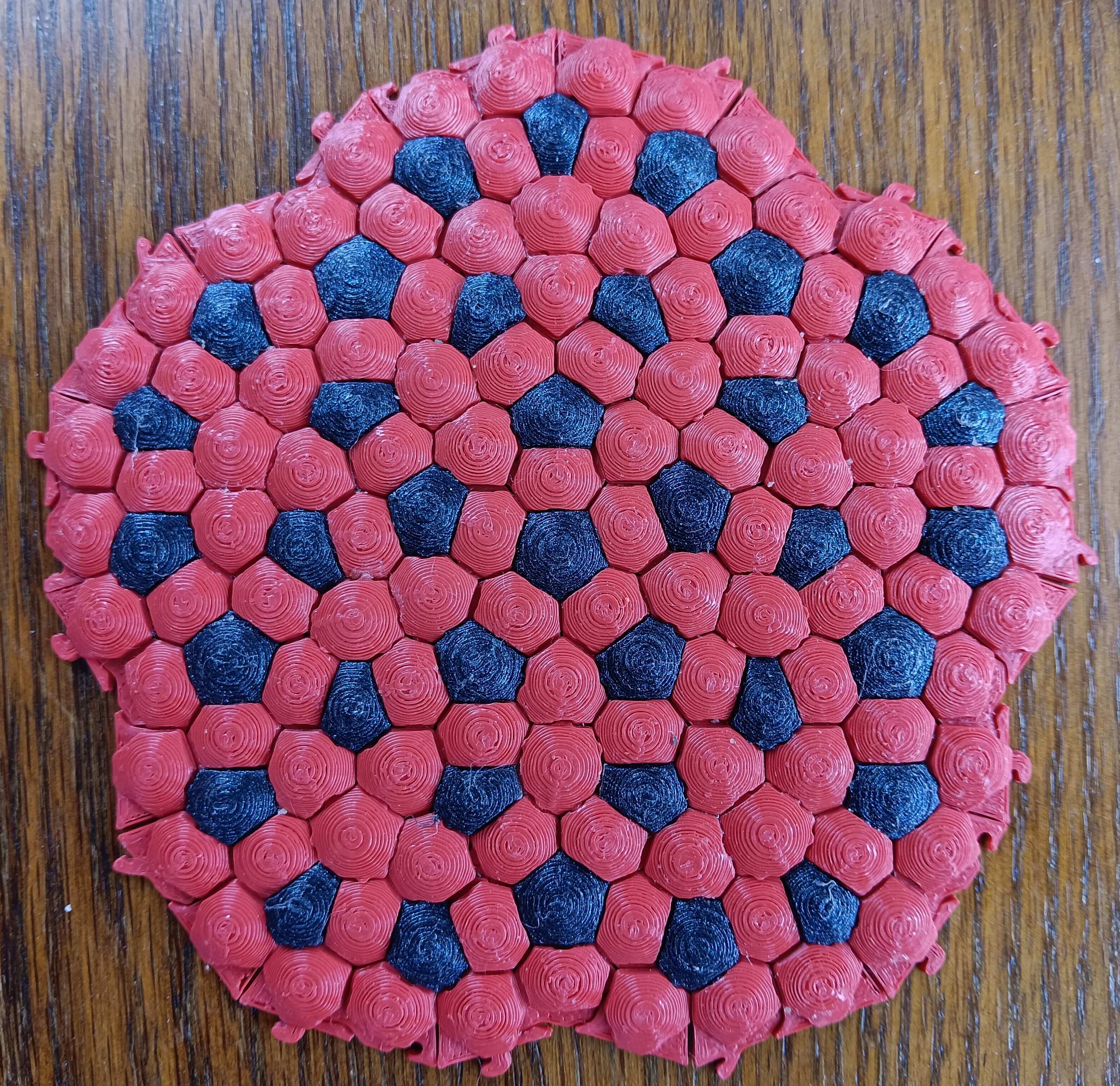 Penrose kite and dart with Voronoi "cobblestone" surface.