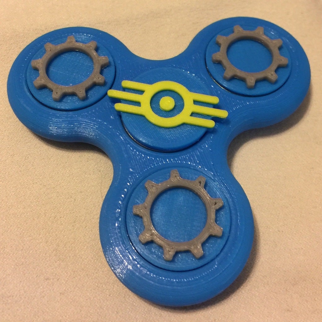 Fidget Tri-Spinner with Themed Bearing Caps