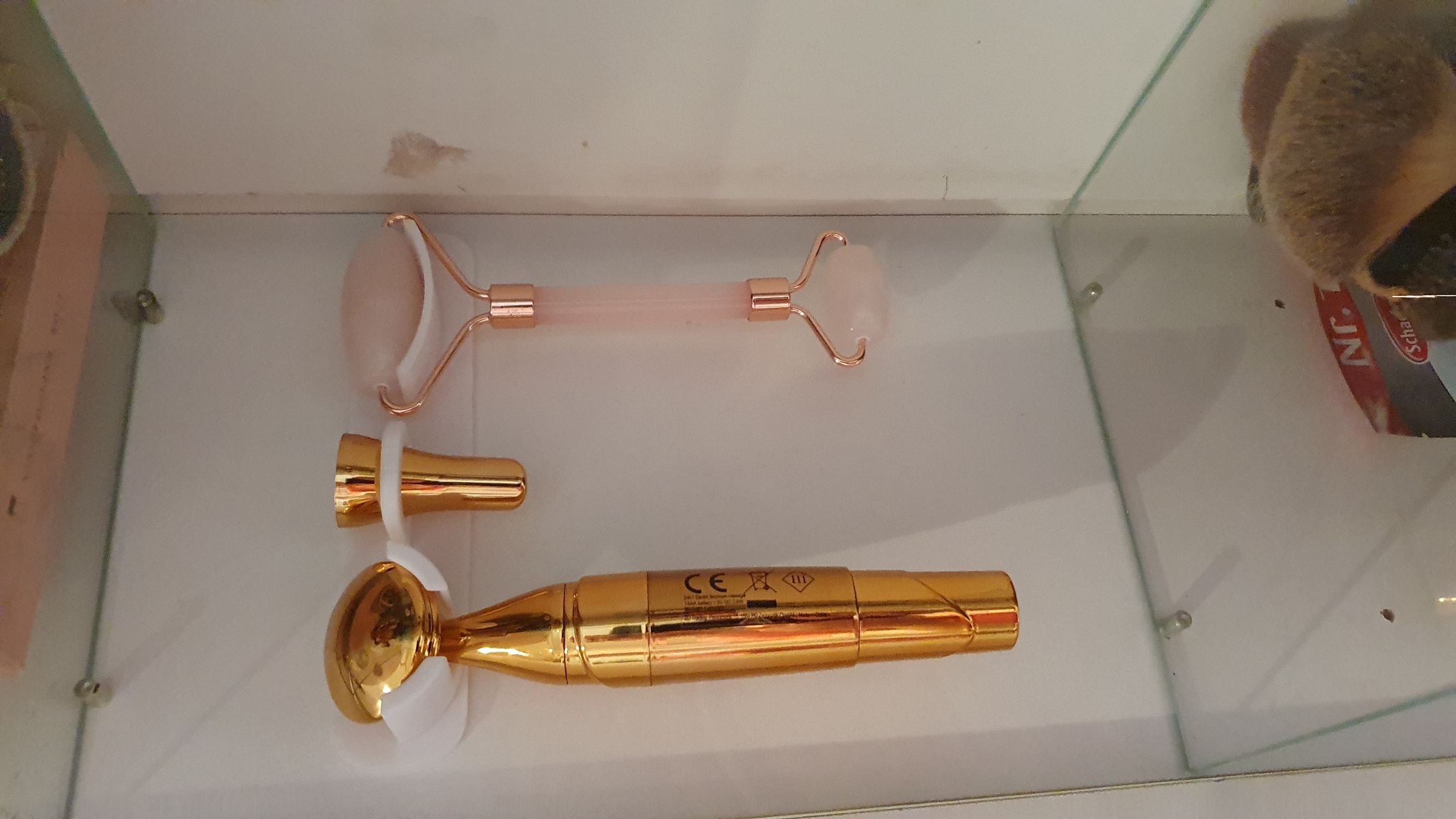 Facial massage tool holder in closet