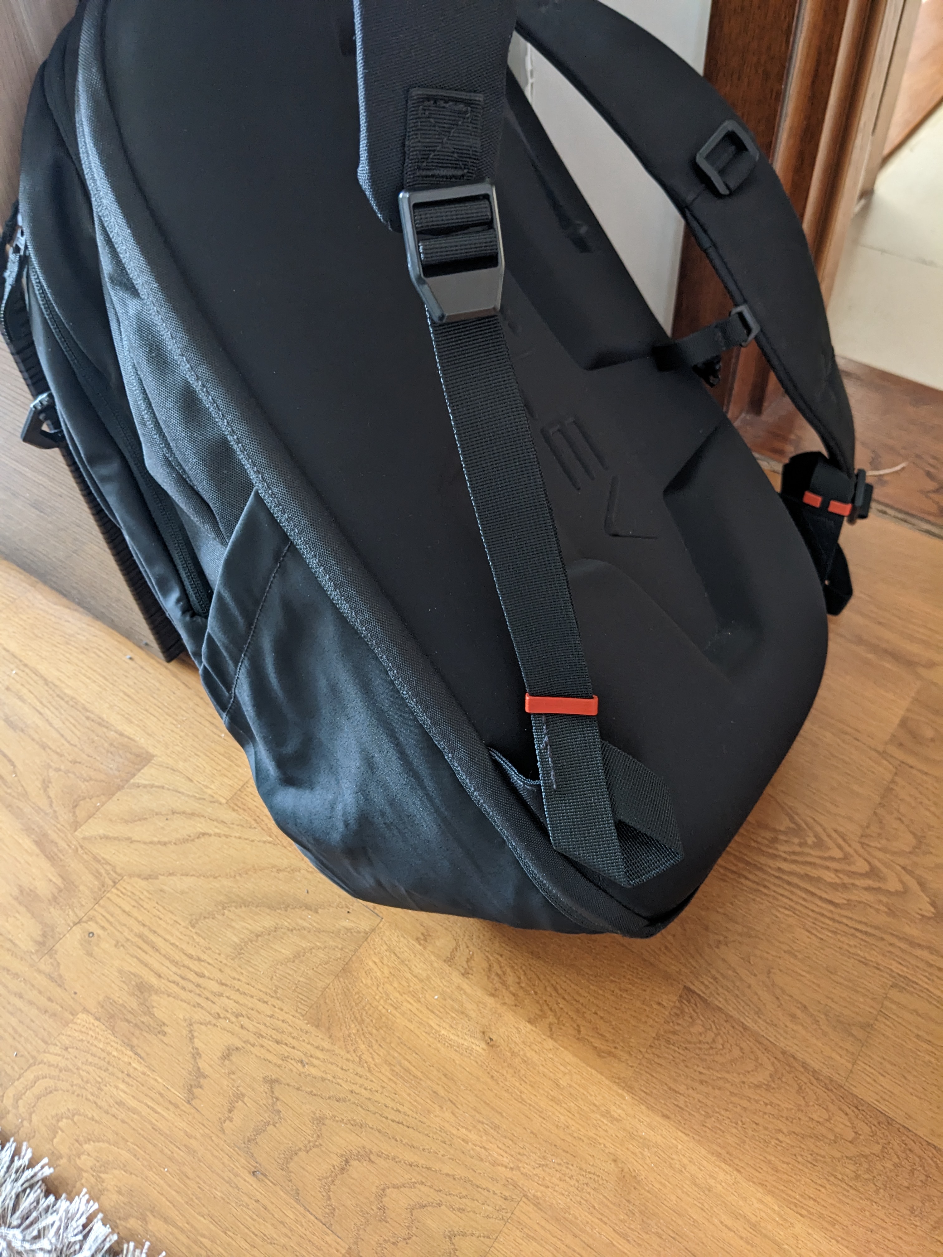 Backpack strap holder