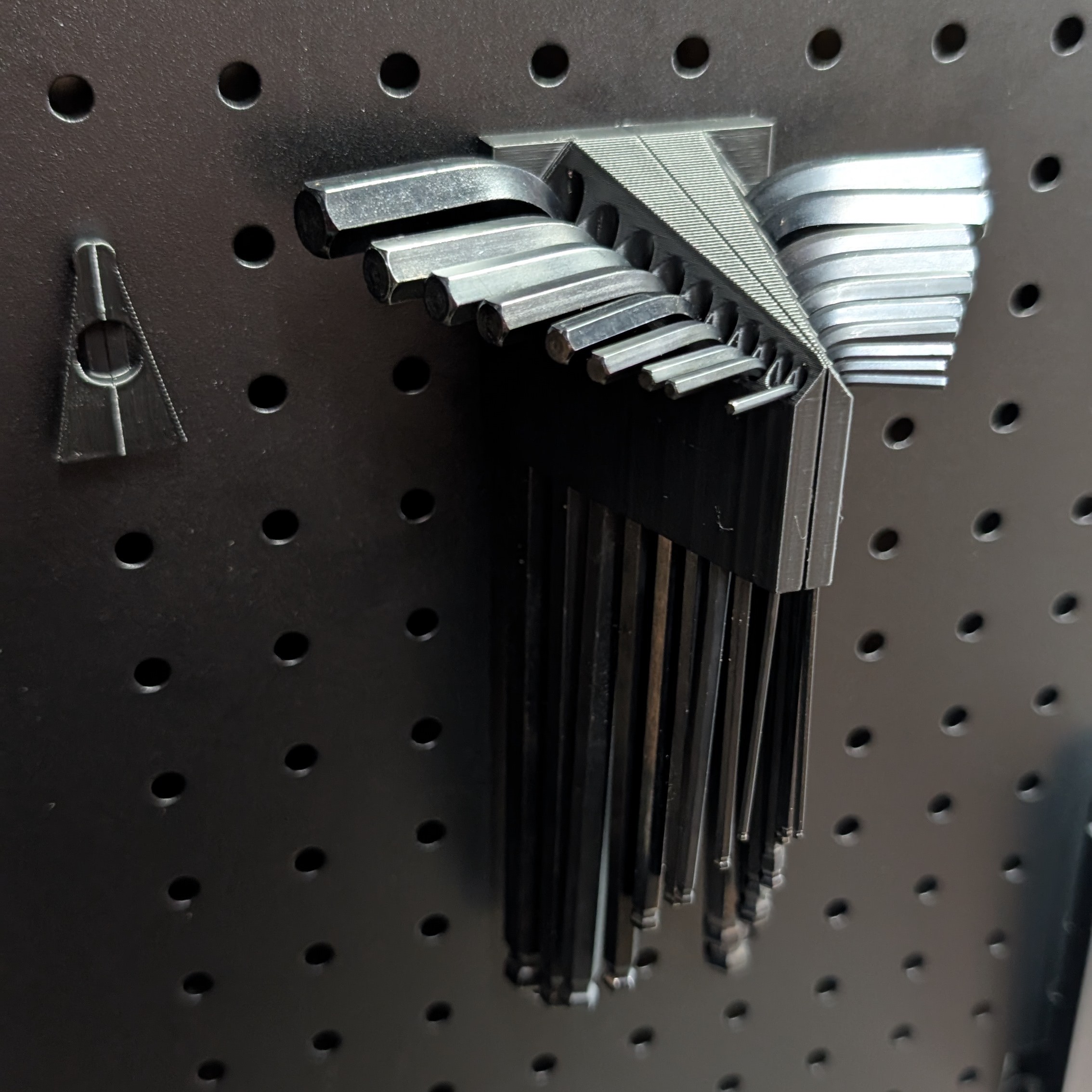 Hex key storage for Sy's peglock system
