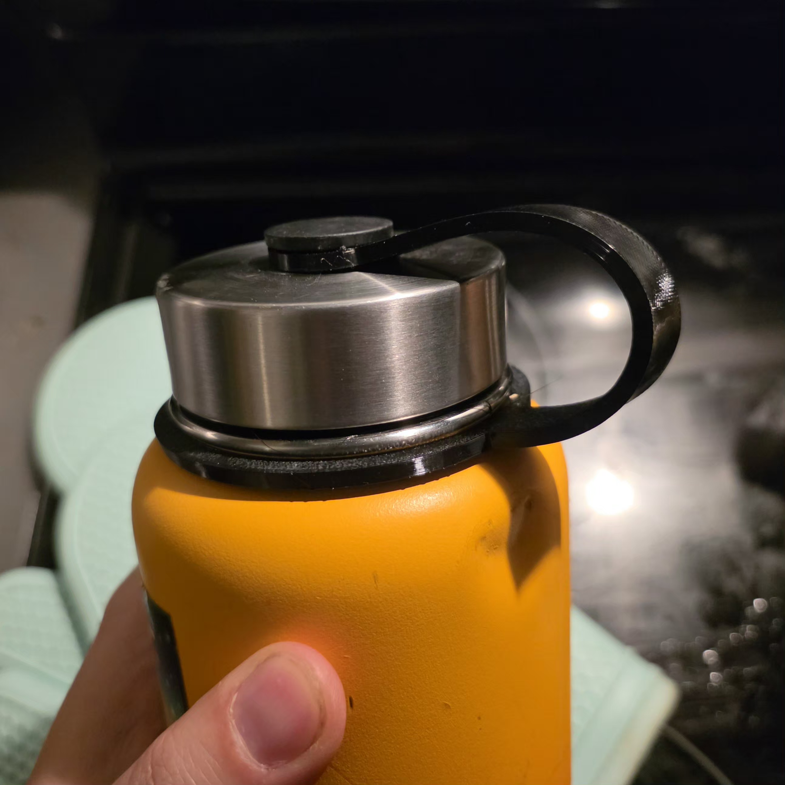 Keeper/retainer strap for "Hydro Cell" water bottle screw lid