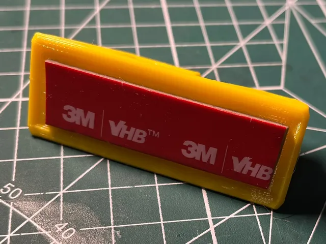 Wall hook with groove for double sided tape