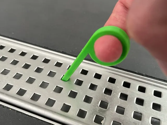 Shower drain hook