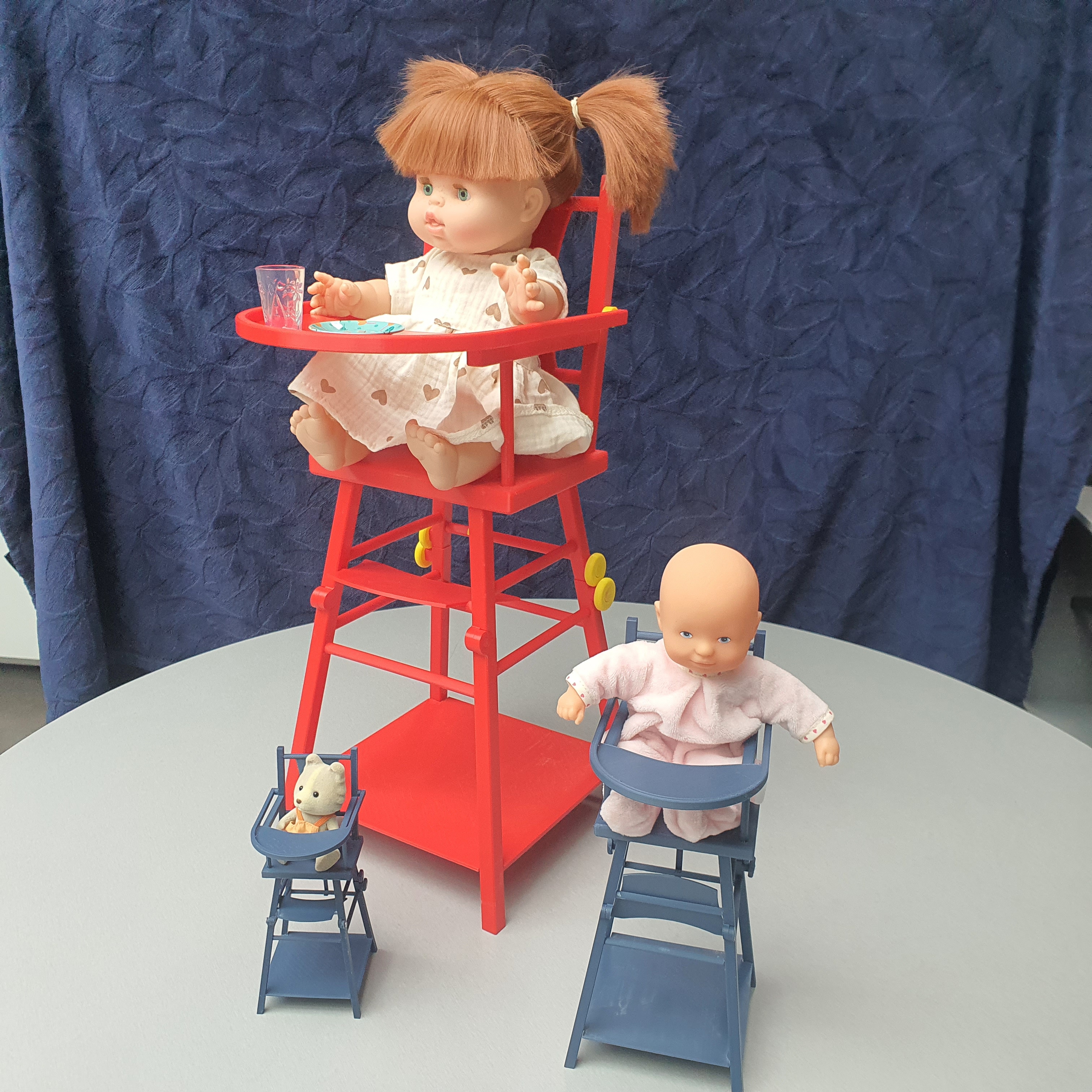 Articulated baby chair for playing with dolls.