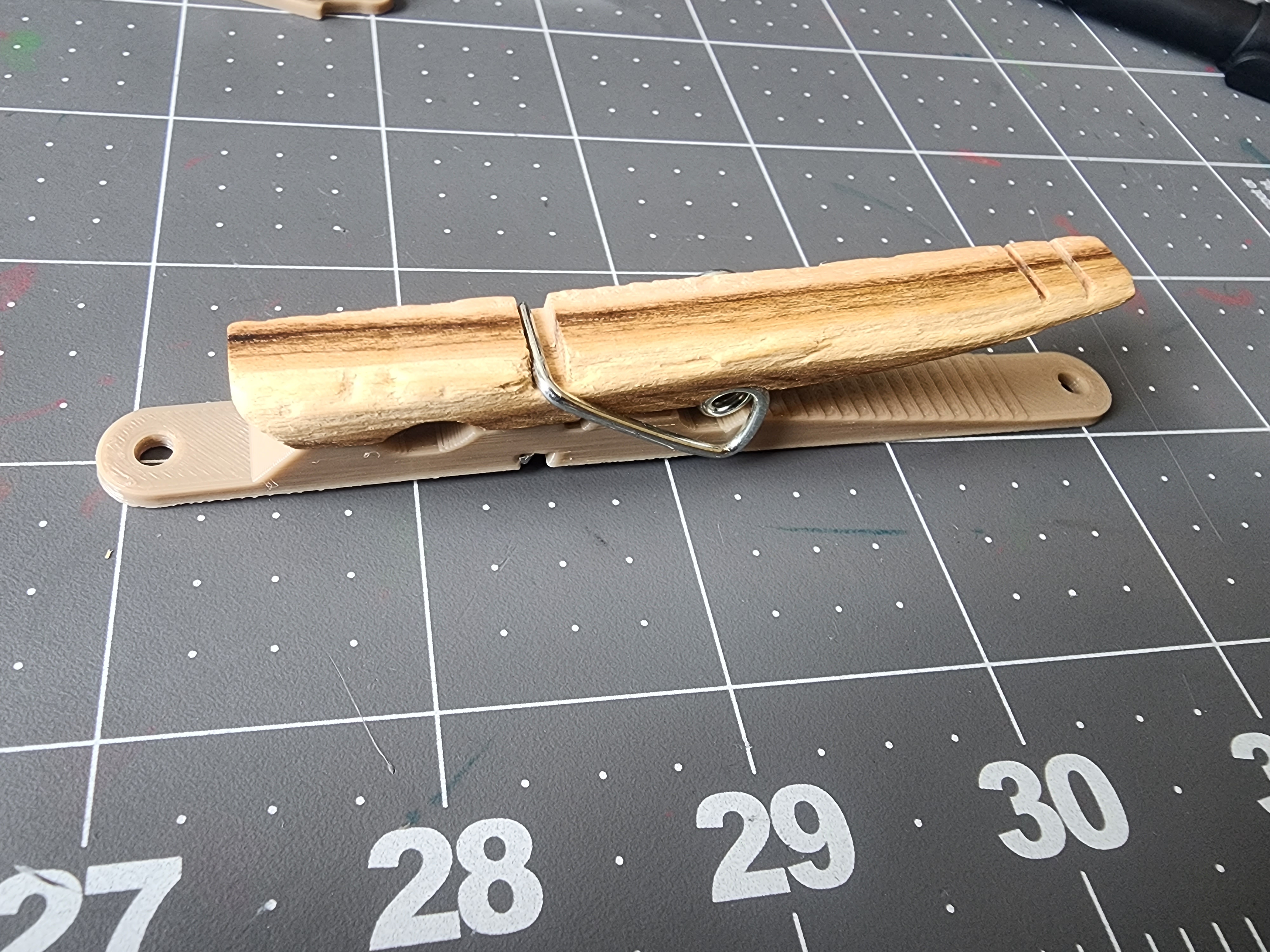 Clothespin with mounting holes
