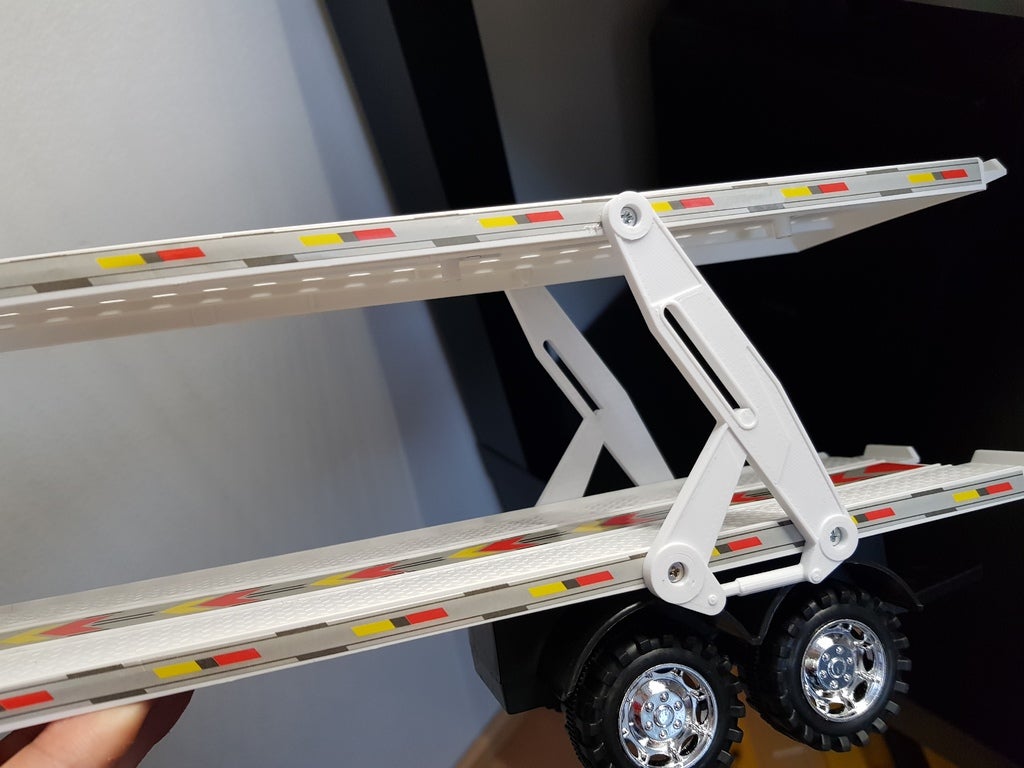 Toy truck trailer support