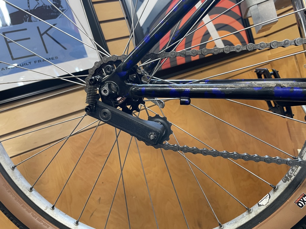 Bicycle chain tensioner