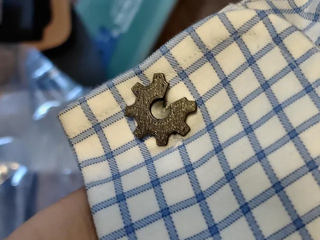 Cufflink with Open Hardware and open source logos