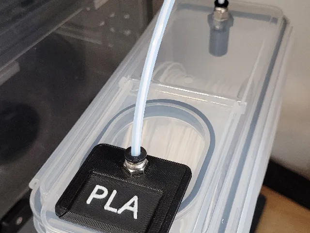 Filament box label holder