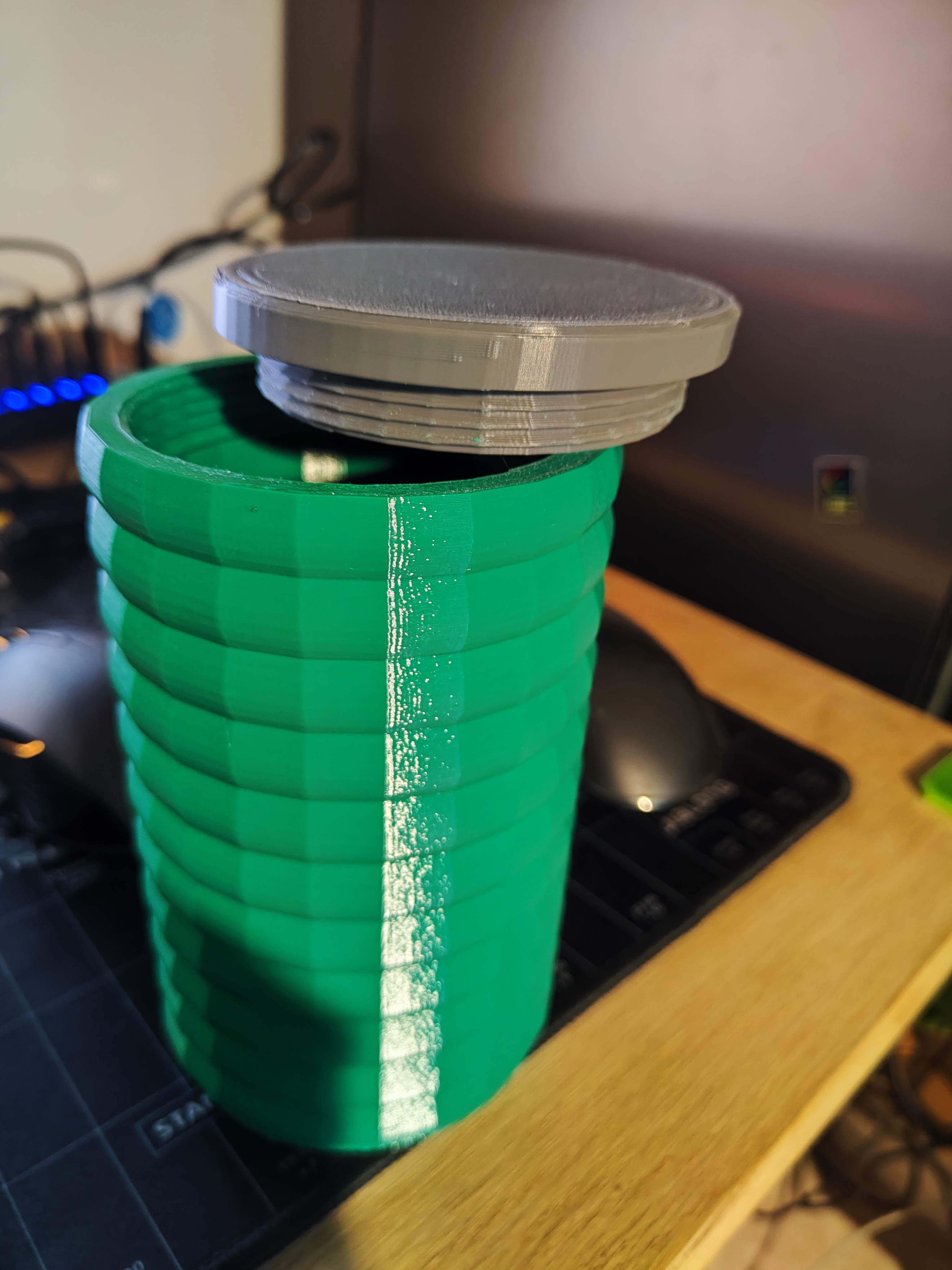 Another rounded box with screw