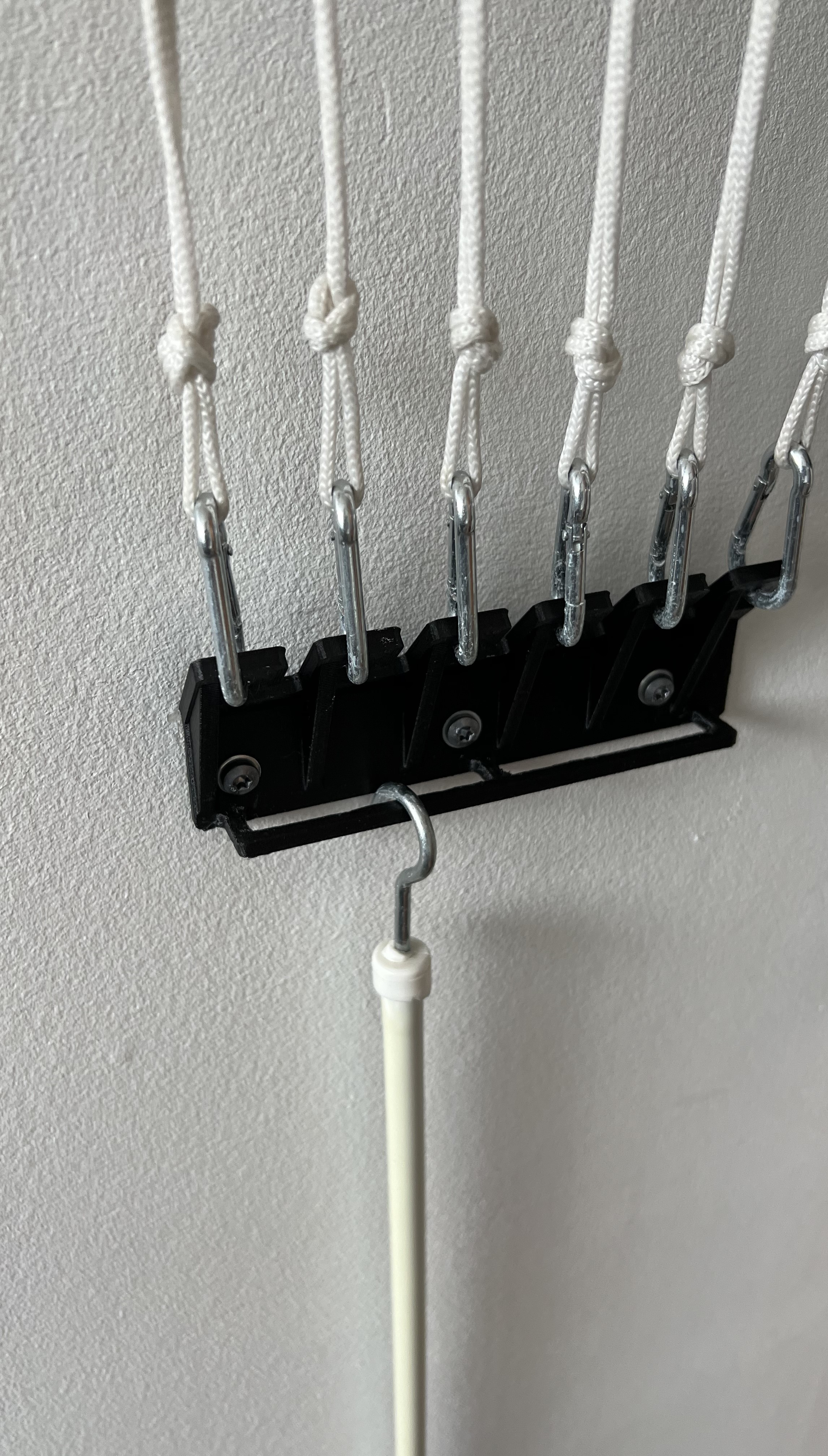 Wall ancor/hook for retractable ceiling mounted clothesline