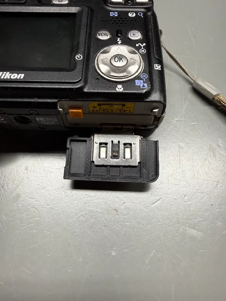 Nikon Coolpix 4200, 5200, 5900, and 7900 Battery Cover Door