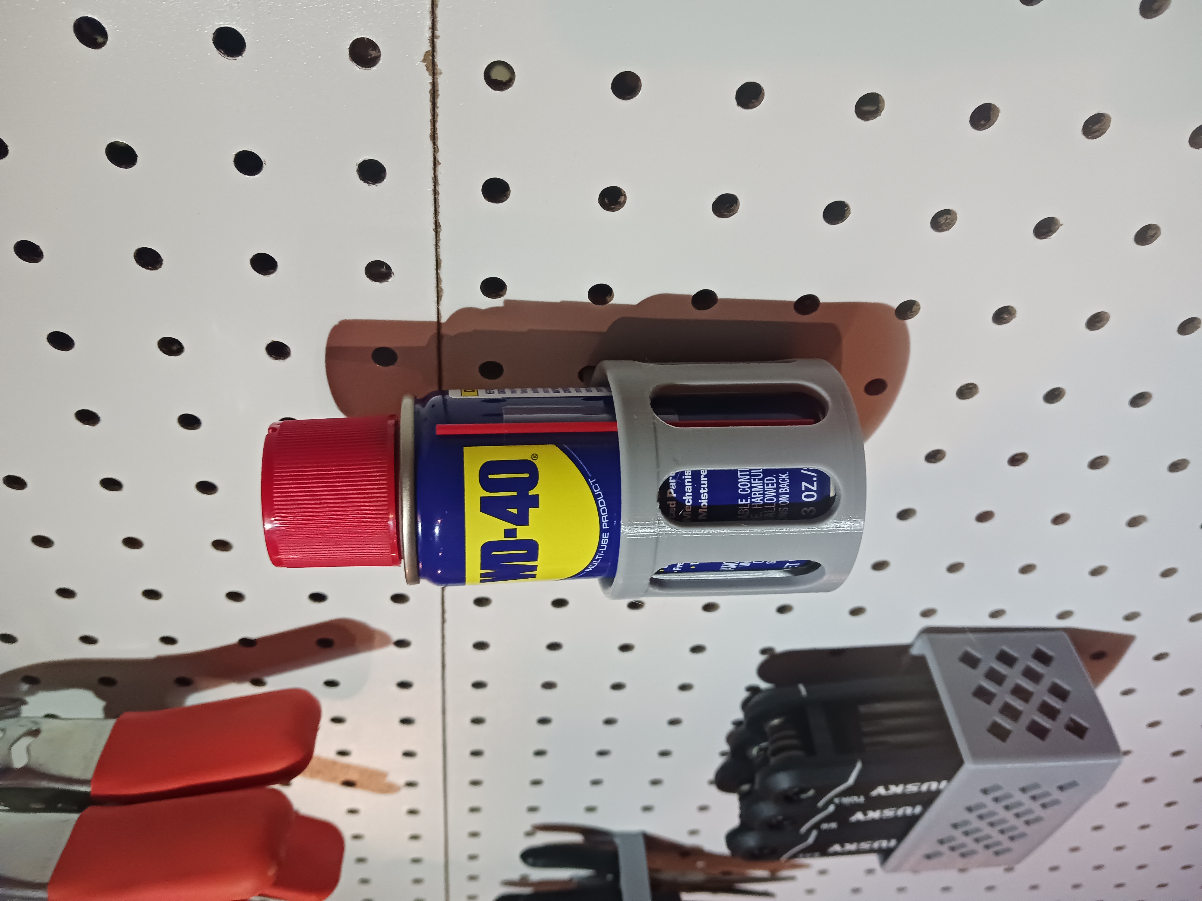 Mini WD-40 holder for 1/4" Pegboard