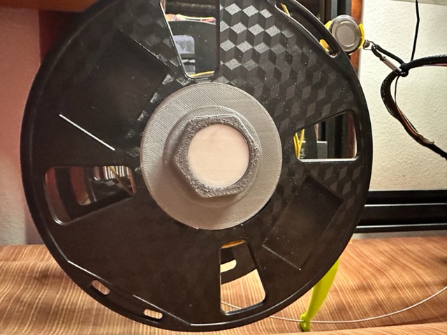 Integrated spool guard and nut
