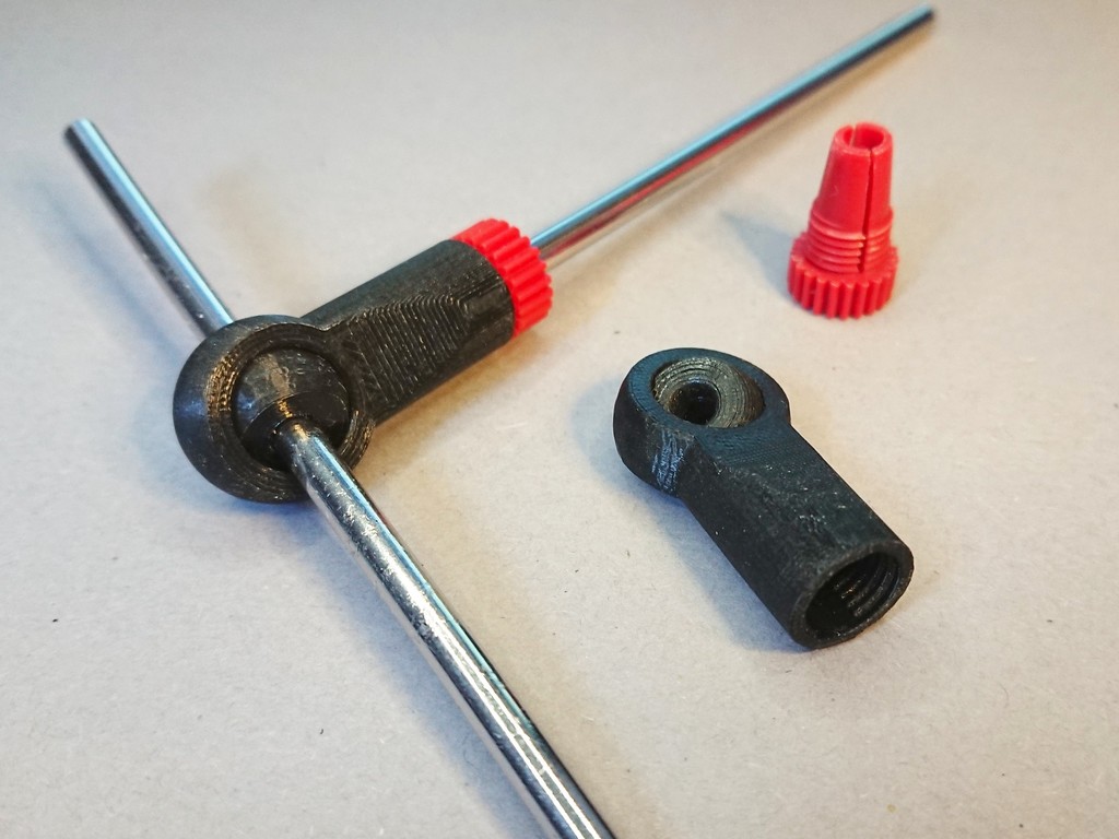 Print-in-place fish-eye rod end for fischertechnik