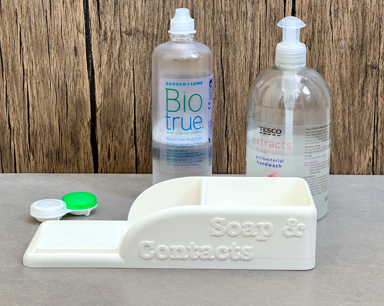 Bathroom organiser tray for a soap dispenser, contact lens liquid and ...