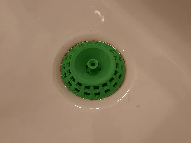 Universal drain strainer - round and angular with handle