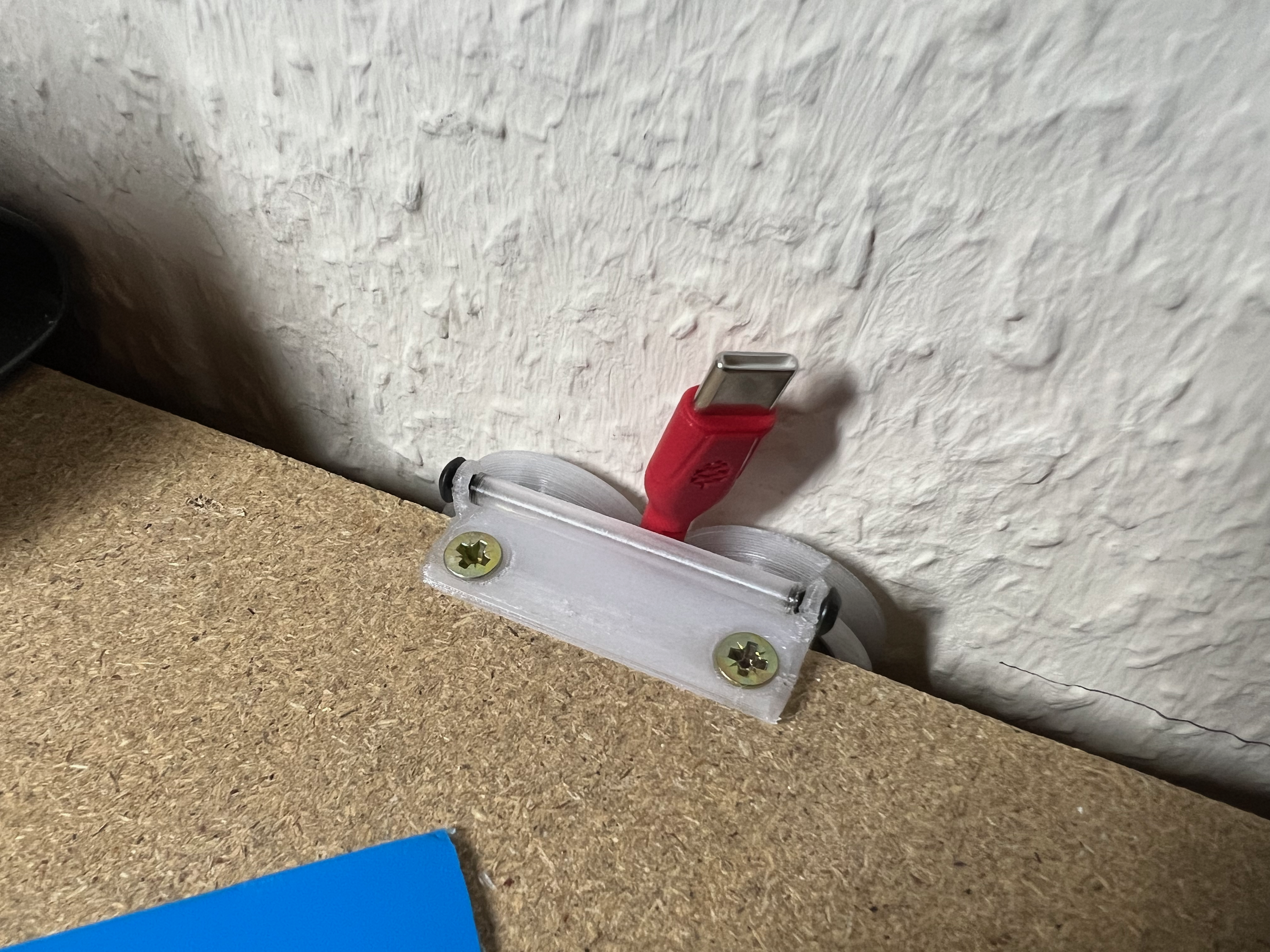 Desk edge cable roller