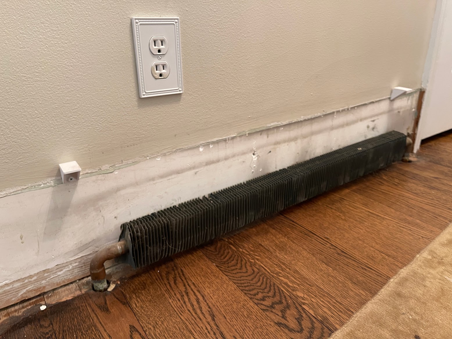 Baseboard heater cover wall bracket by Troye Stonich Download free
