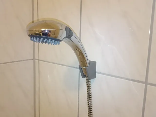 Shower head holder for wall