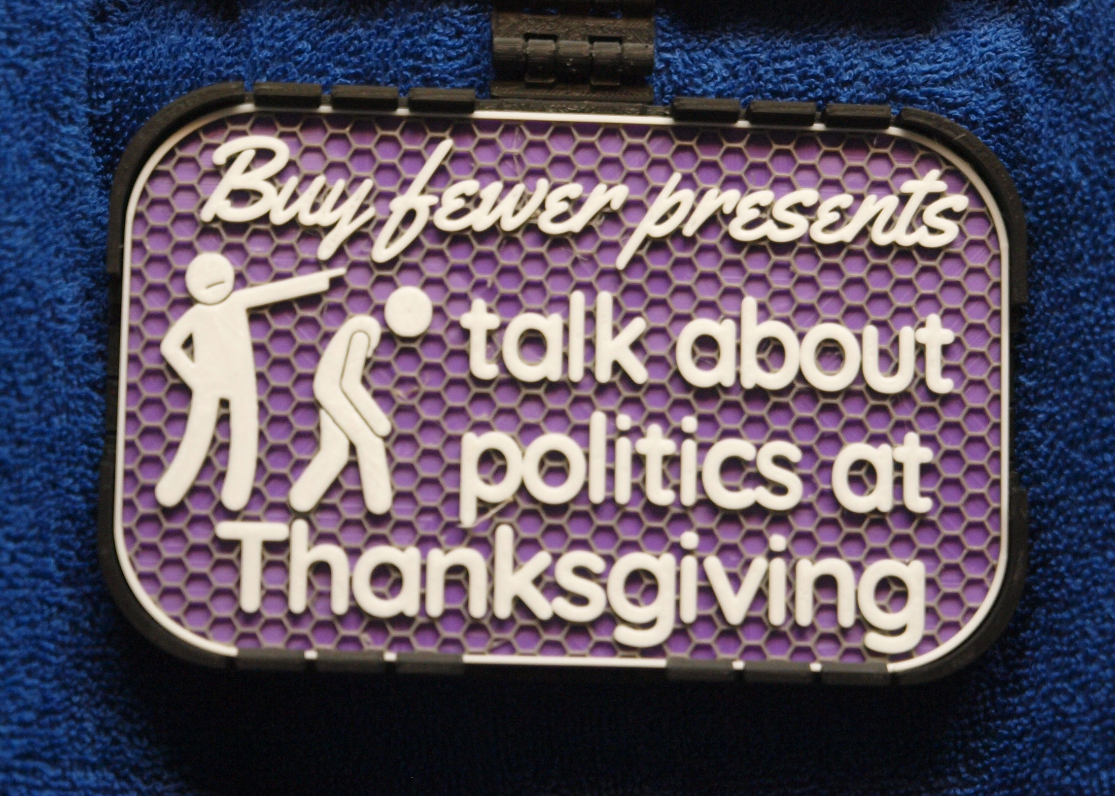 Buy fewer presents sign