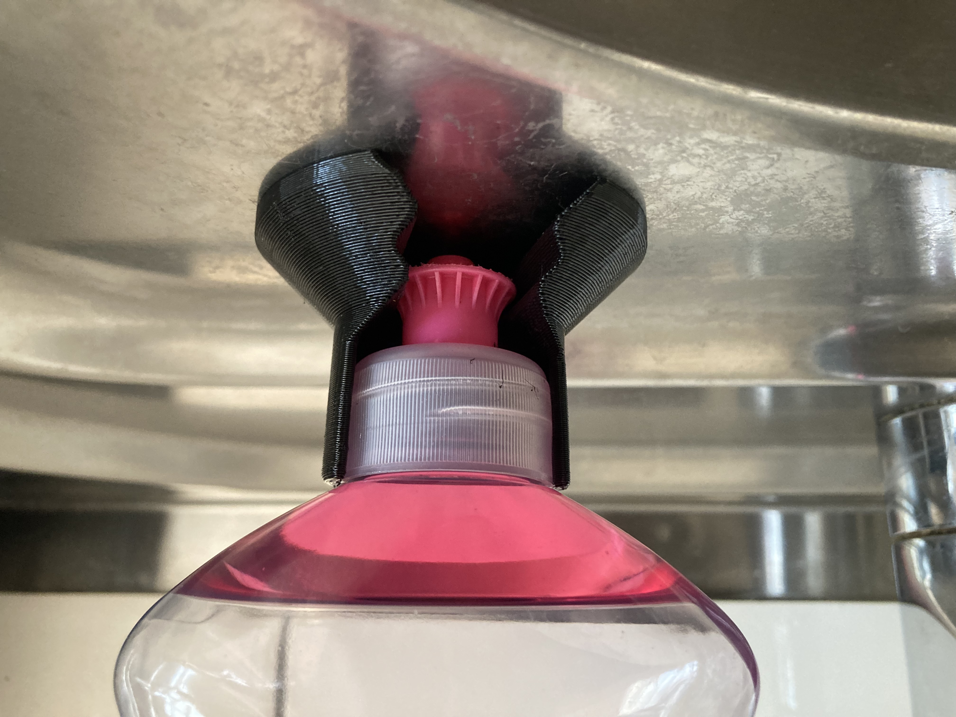 Upside down dishwashing liquid holder