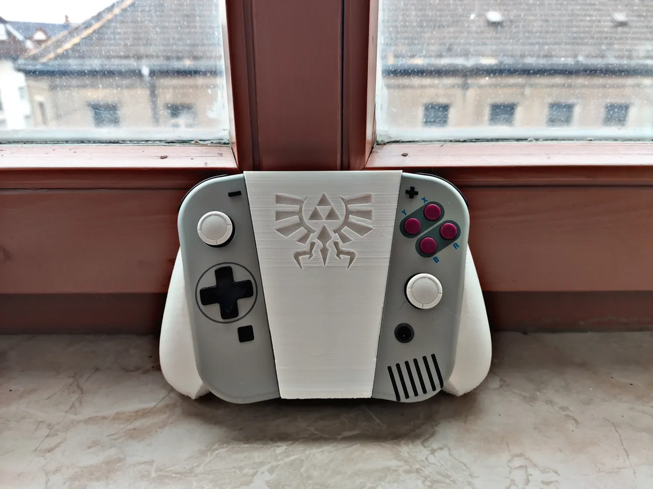 Nintendo Switch Ergonomic JoyCon Grip with Zelda Crest by Lucullust, Download free STL model
