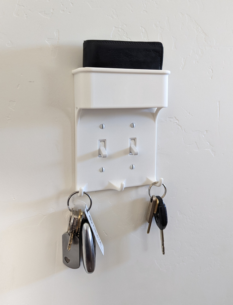 Light switch plate w/ key hooks & wallet pocket
