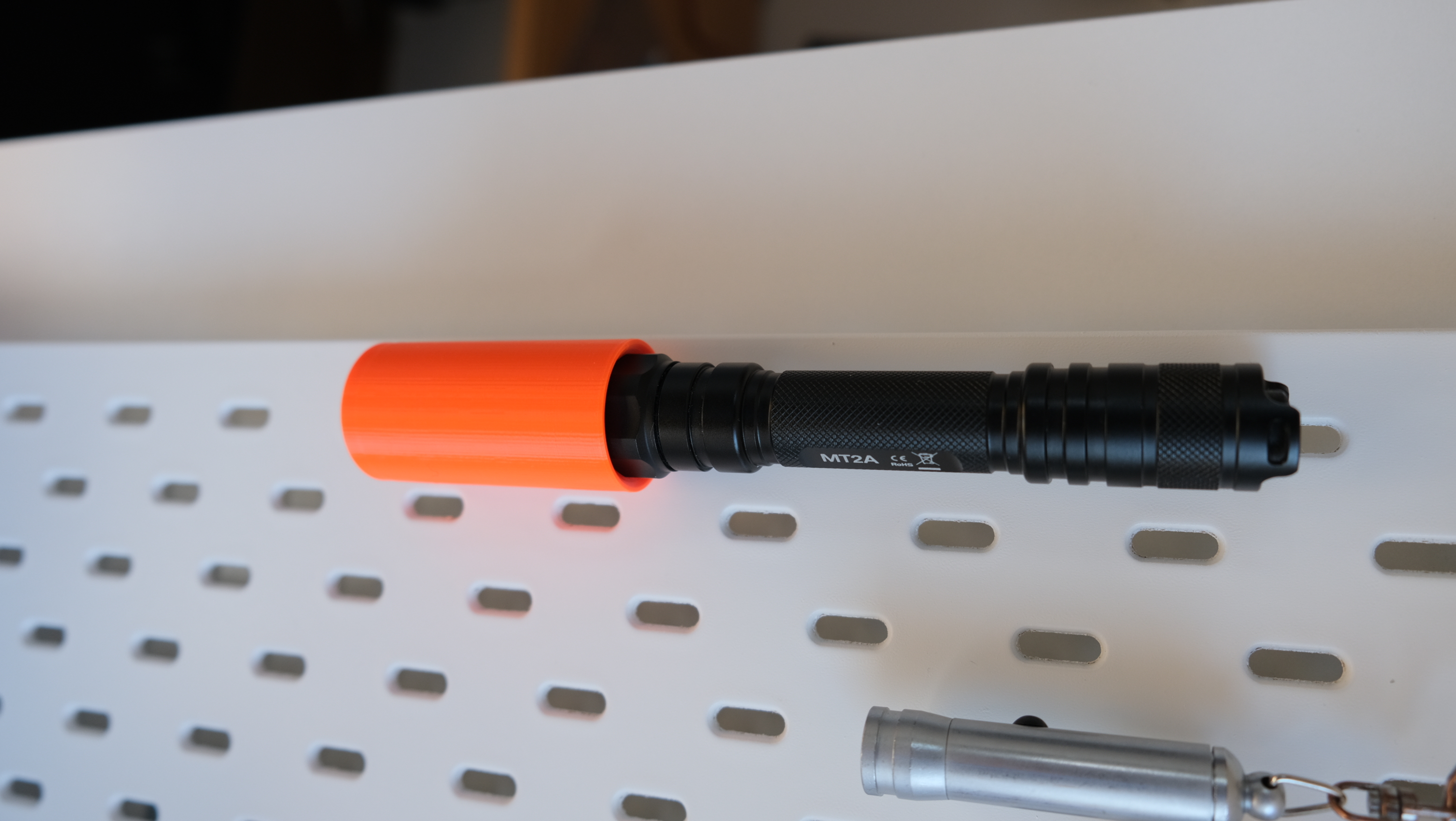 Flashlight holder for IKEA skadis (SKÅDIS)