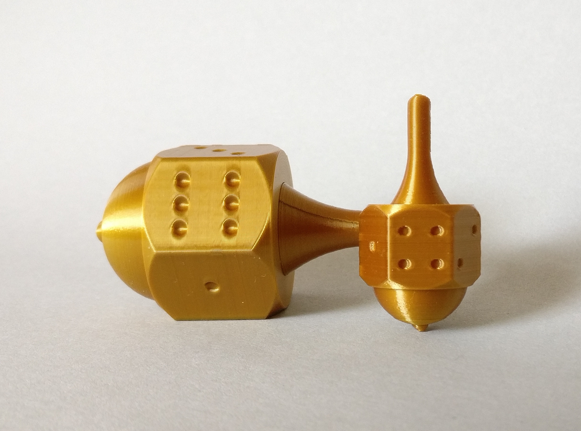 A dice? A spinning top? Both!