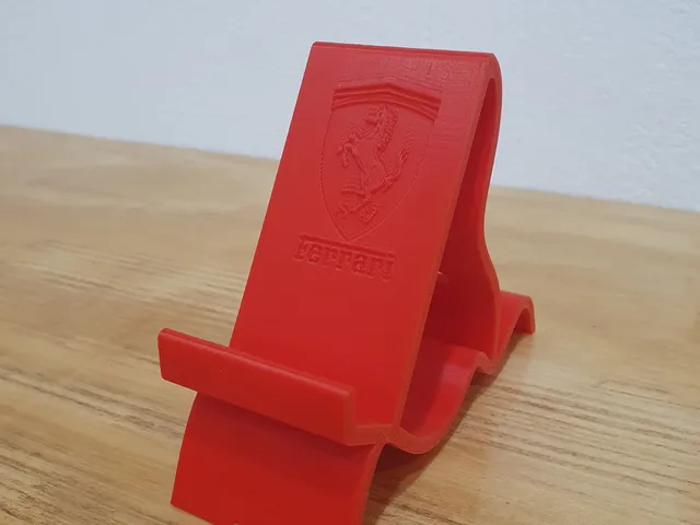 Soporte de telefono con el logo de Ferrari