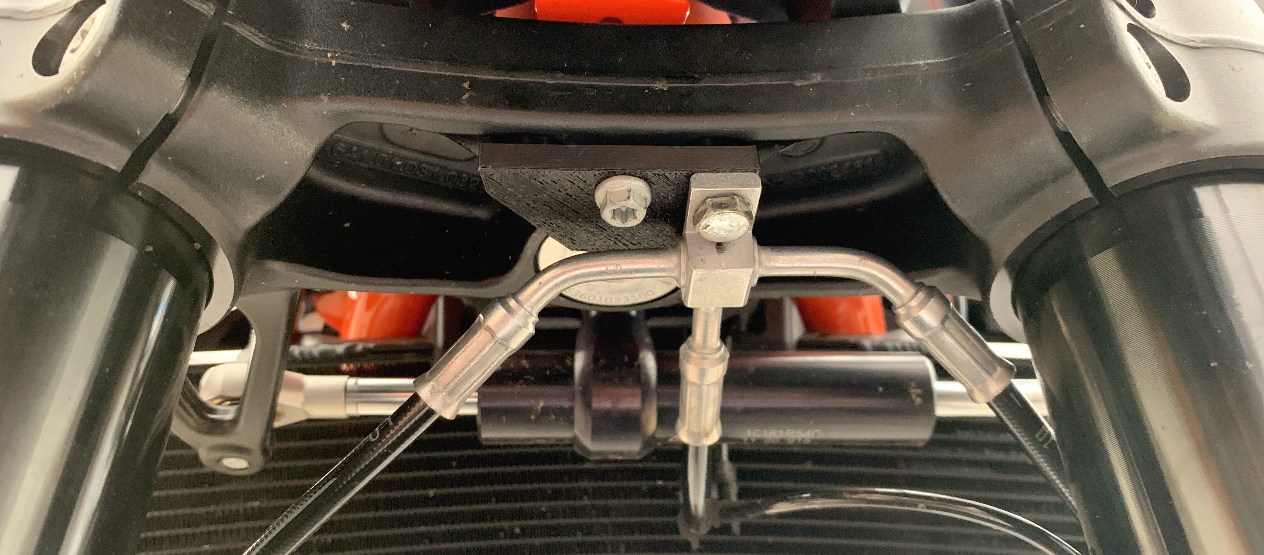 KTM Duke 890R front brake line relocation bracket