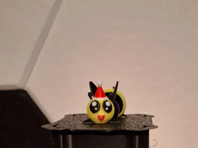 Tiny articulating Santa Bee