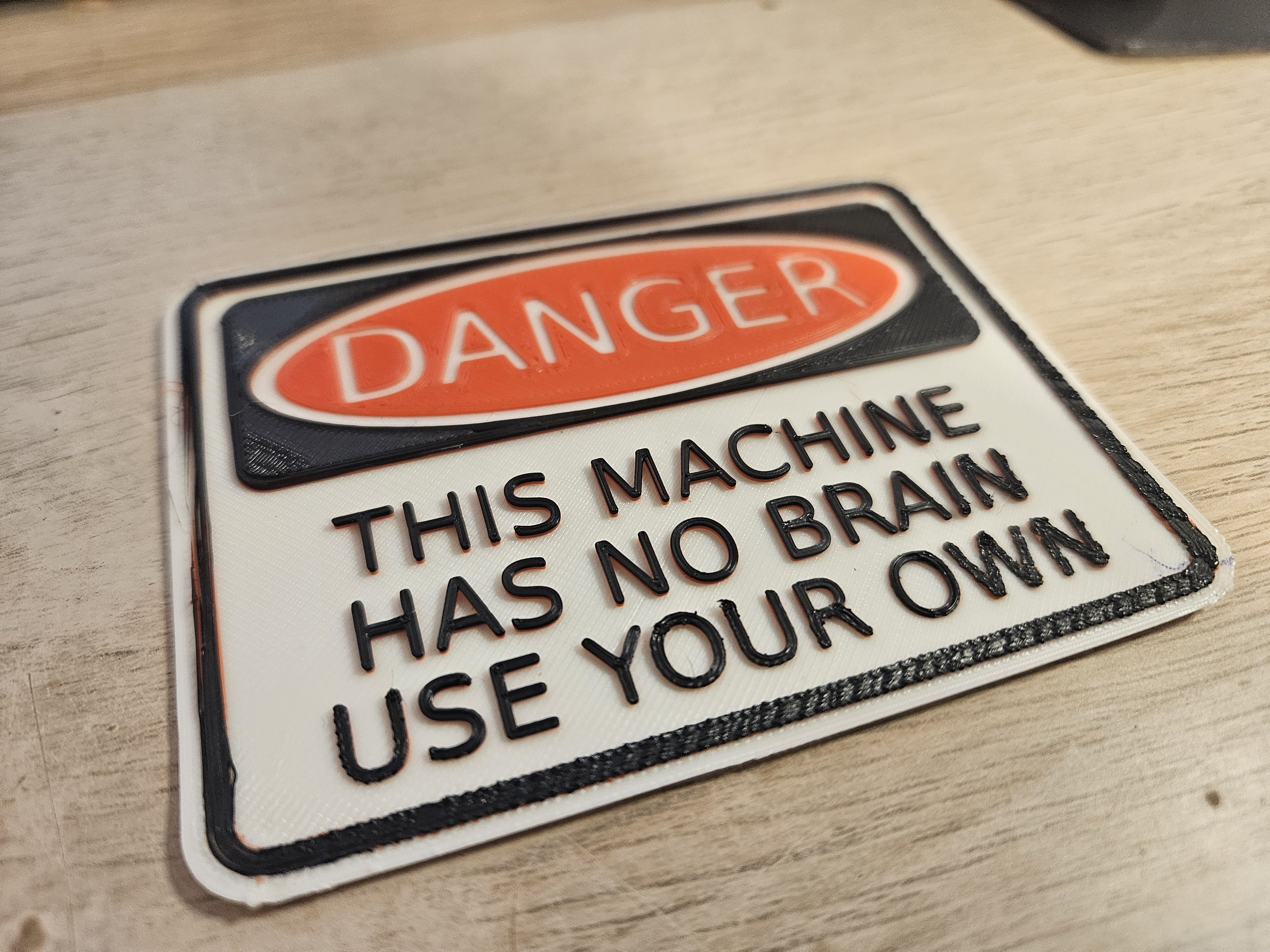 "This Machine Has No Brain" sign