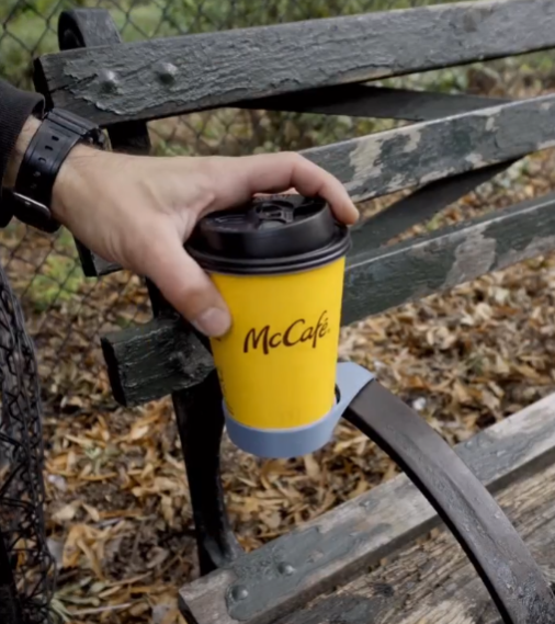 coffee stand on park bench