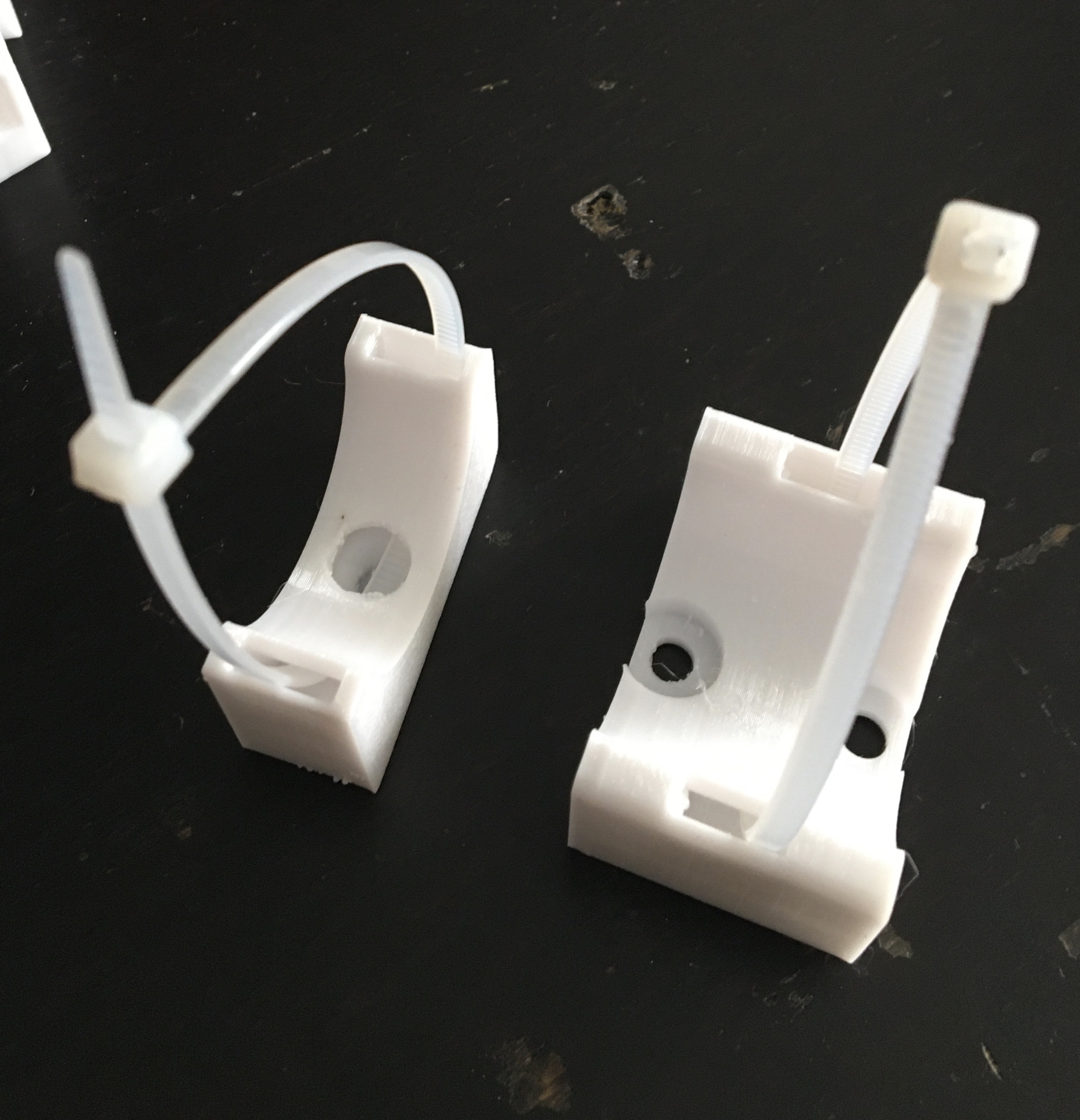 Cable holder for attaching corrugated tubing to the wall by santiniki