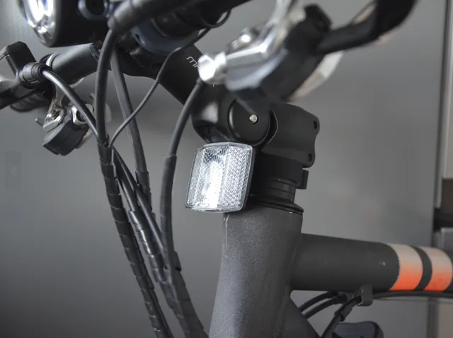 Universal bicycle reflector holder