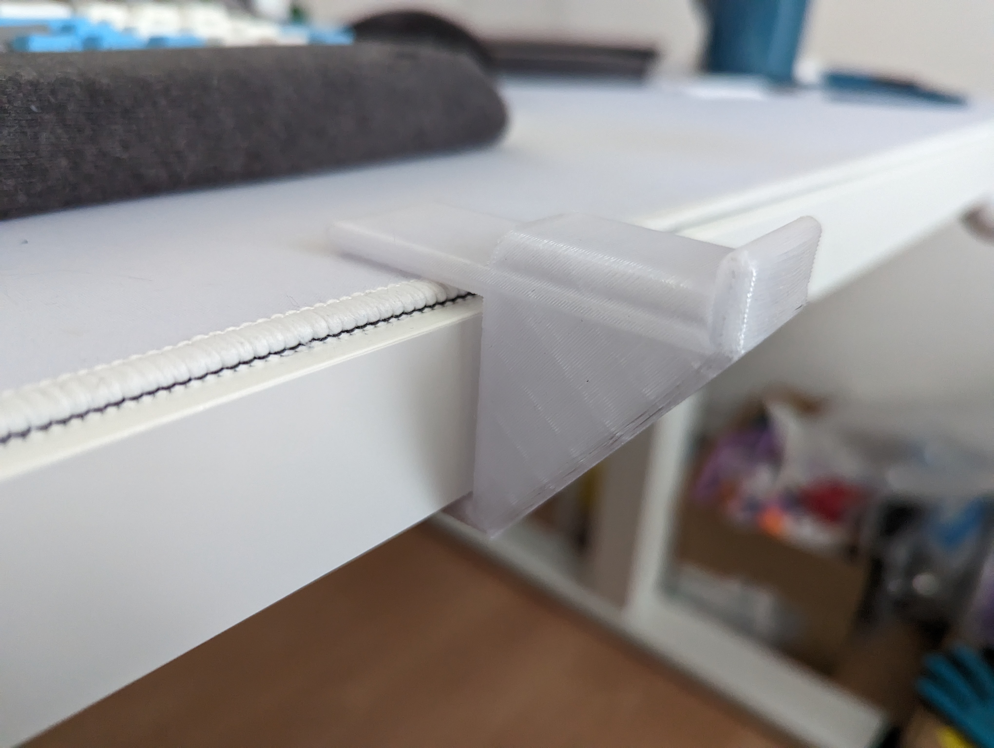 Simple headphones hanger for desk.