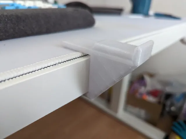 Simple headphones hanger for desk.