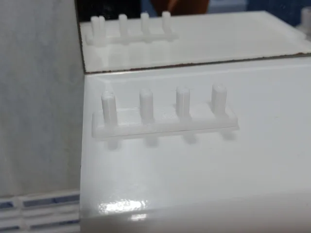 Electric Oral B toothbrush heads support