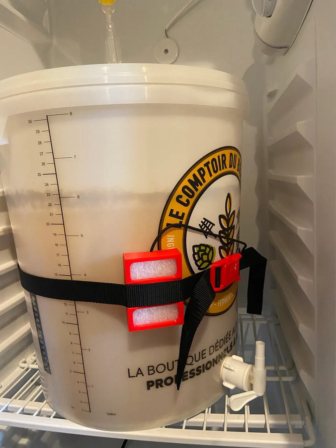Temperature sensor holder attached to a fermenter