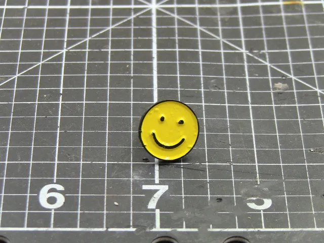 Smiley face enamel pin