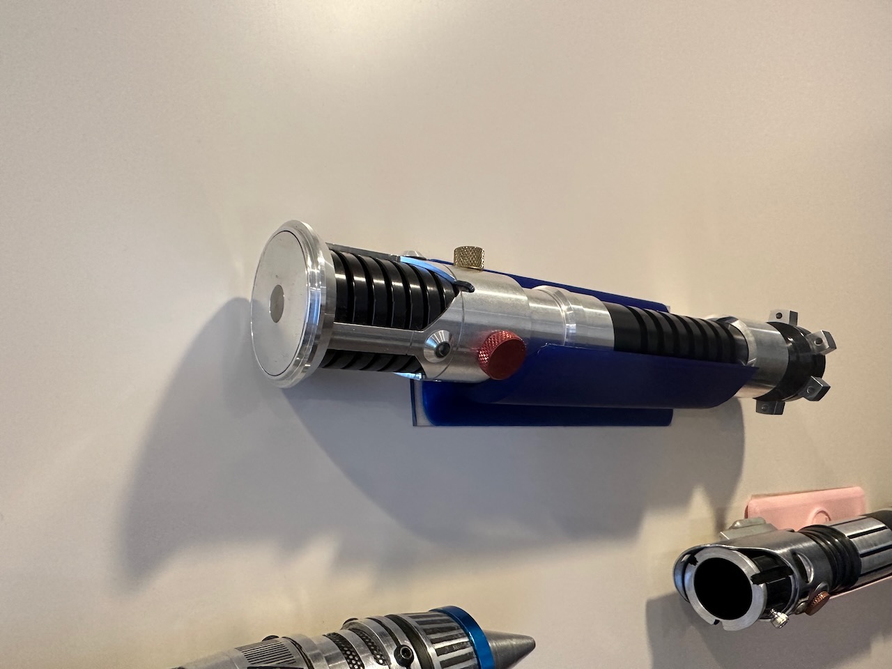 Lightsaber holder for the wall twosided tape install by Takeo