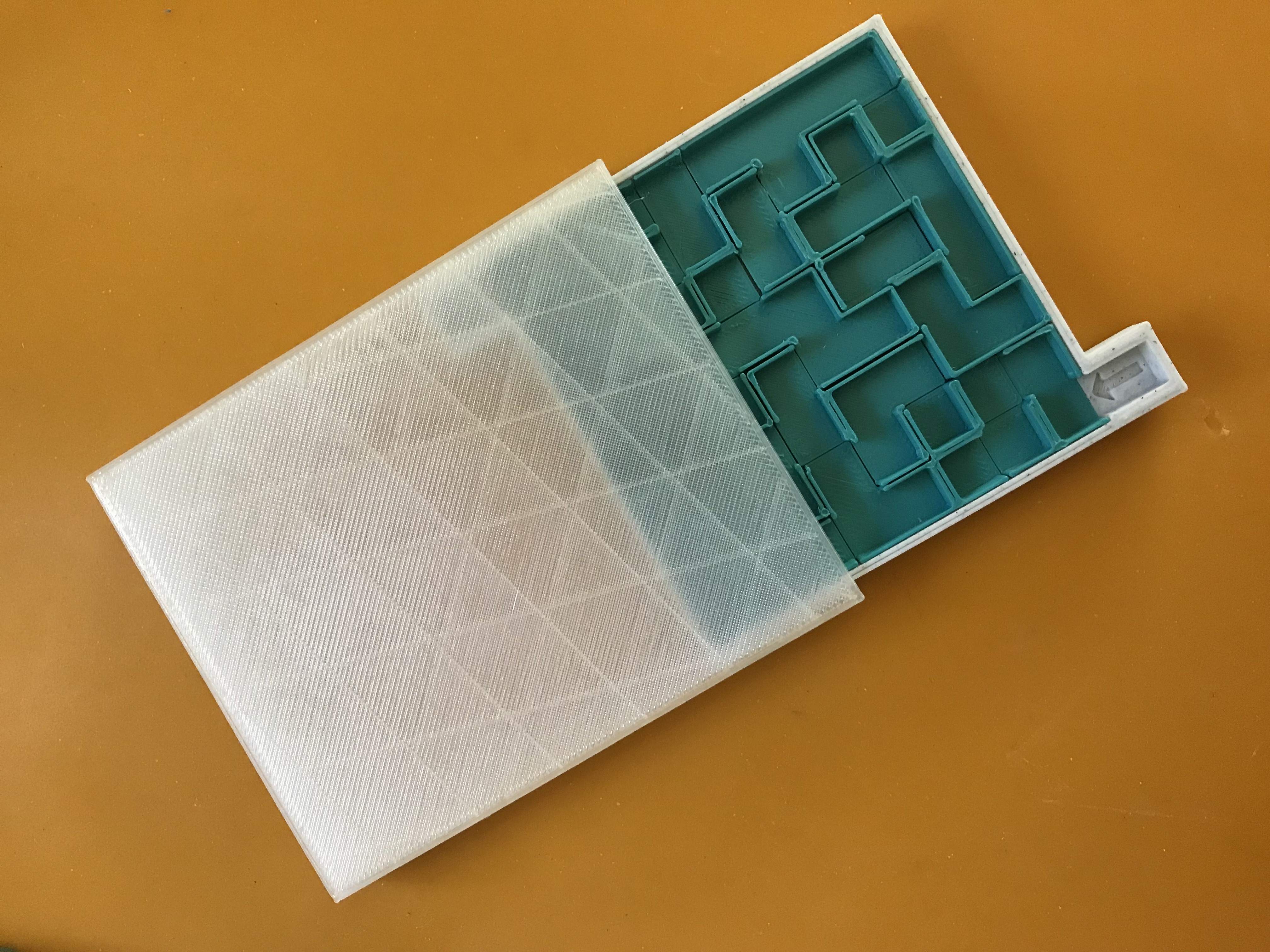 Sliding lid for Rapideau's puzzle