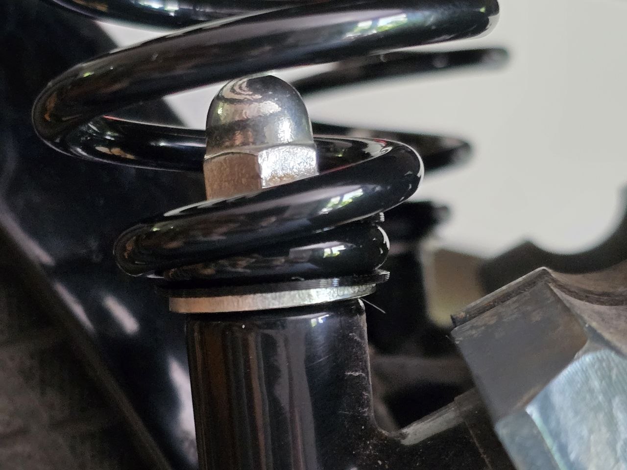 Motorcycle Solo Seat Spring Isolation System ("Bobber Saver")