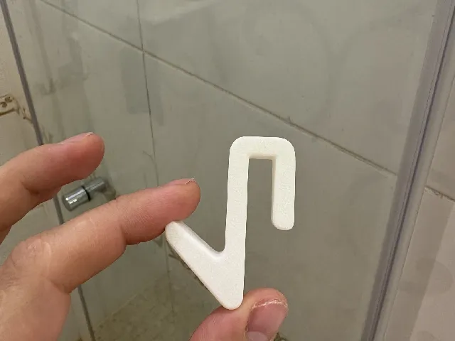 Towel hook on the shower glass door