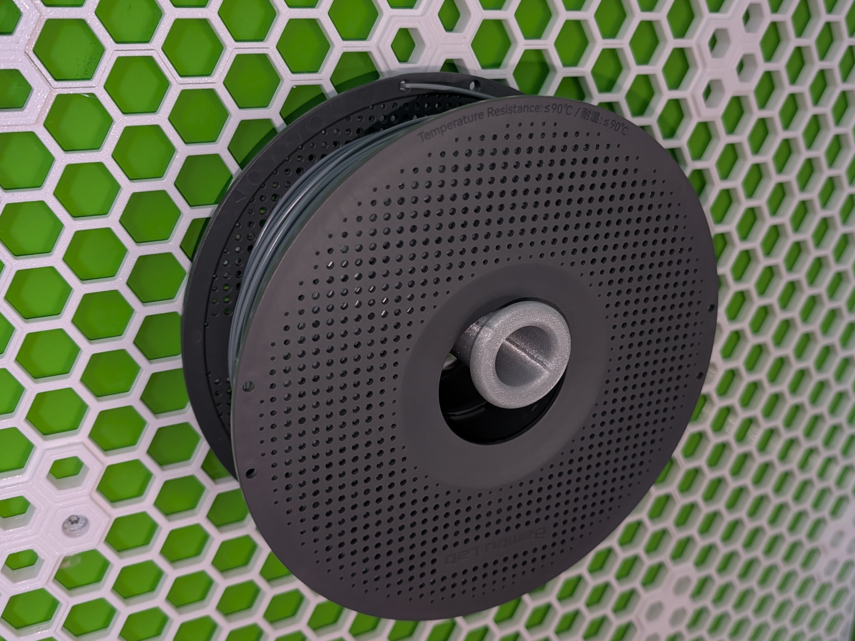 Honeycomb storage wall spool holder