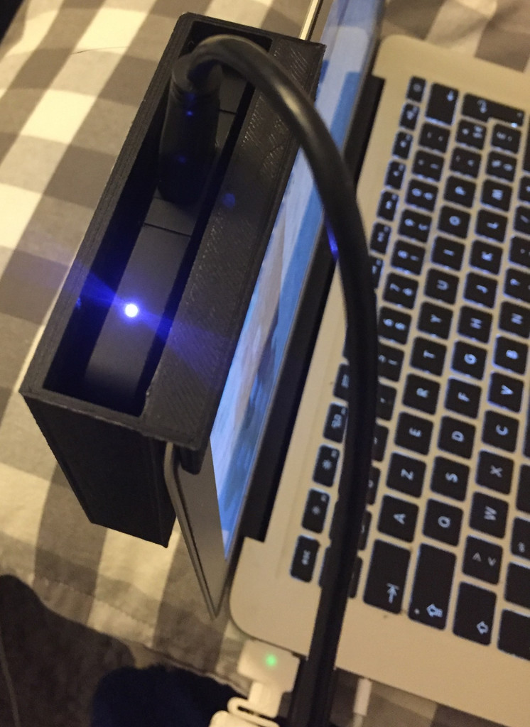 WD Passport holder for Mac Book Air screen.